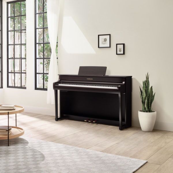 Yamaha CLP-835 Clavinova Digital Piano Rosewood against wall in loungeroom