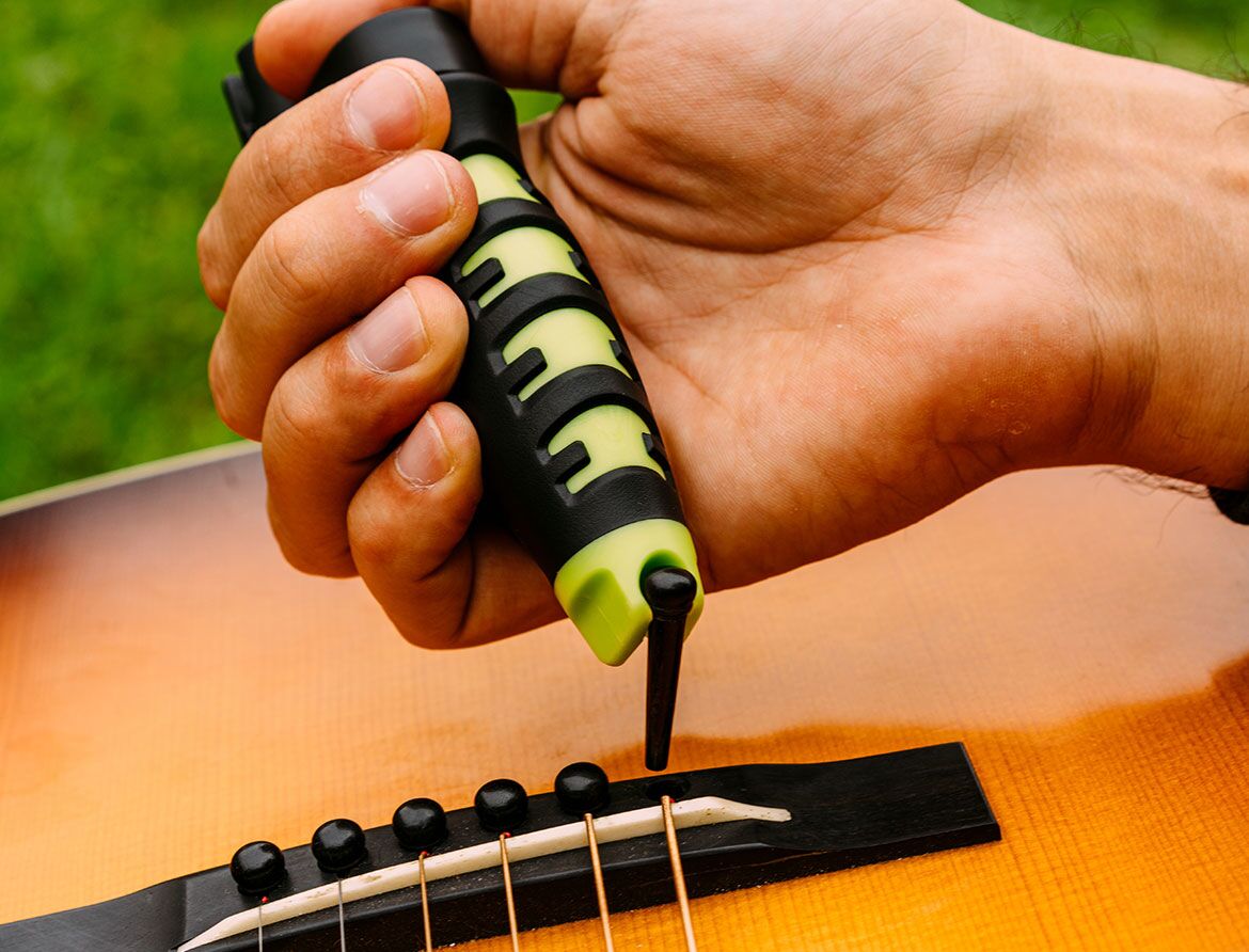 Bridge pin removal tool is integrated into the Ernie Ball Pegwinder Plus
